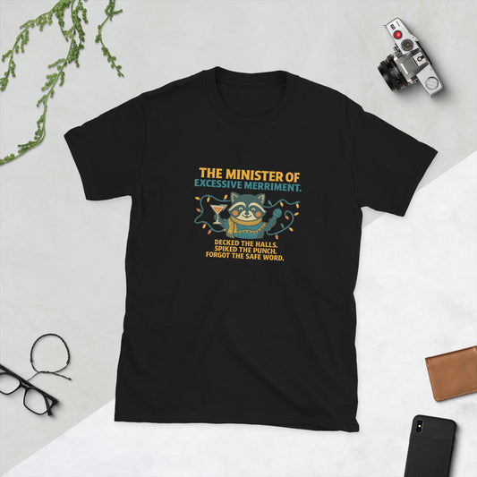 Black t-shirt with humorous text and graphic on a light gray surface with accessories.